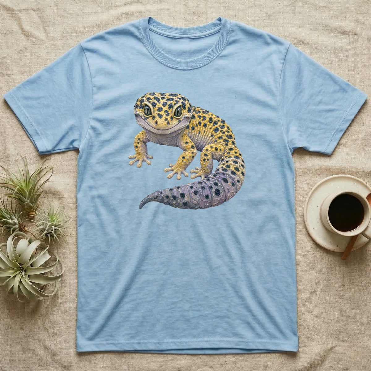 Light blue t-shirt featuring a detailed illustration of a leopard gecko.