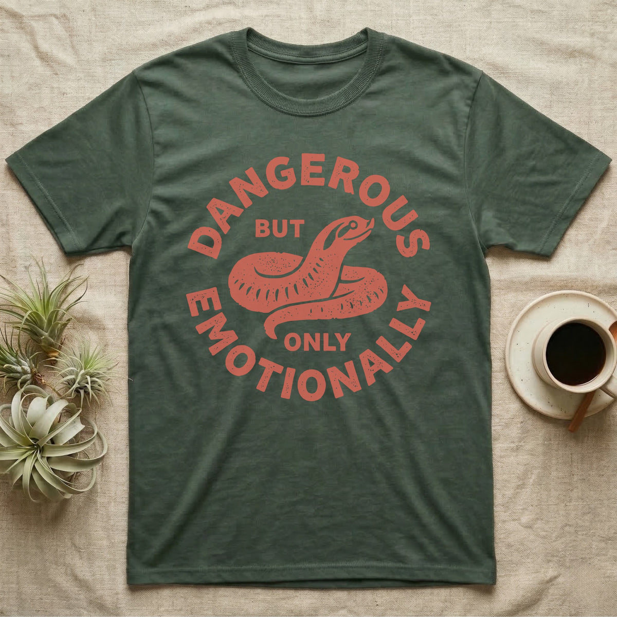 Hognose Snake Emotionally Dangerous T-Shirt in Military Green — Block-print western hognose snake reared in one terracotta ink, ringed by the words DANGEROUS BUT ONLY EMOTIONALLY.
