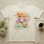 Three colorful geckos stacked on a cream t-shirt.