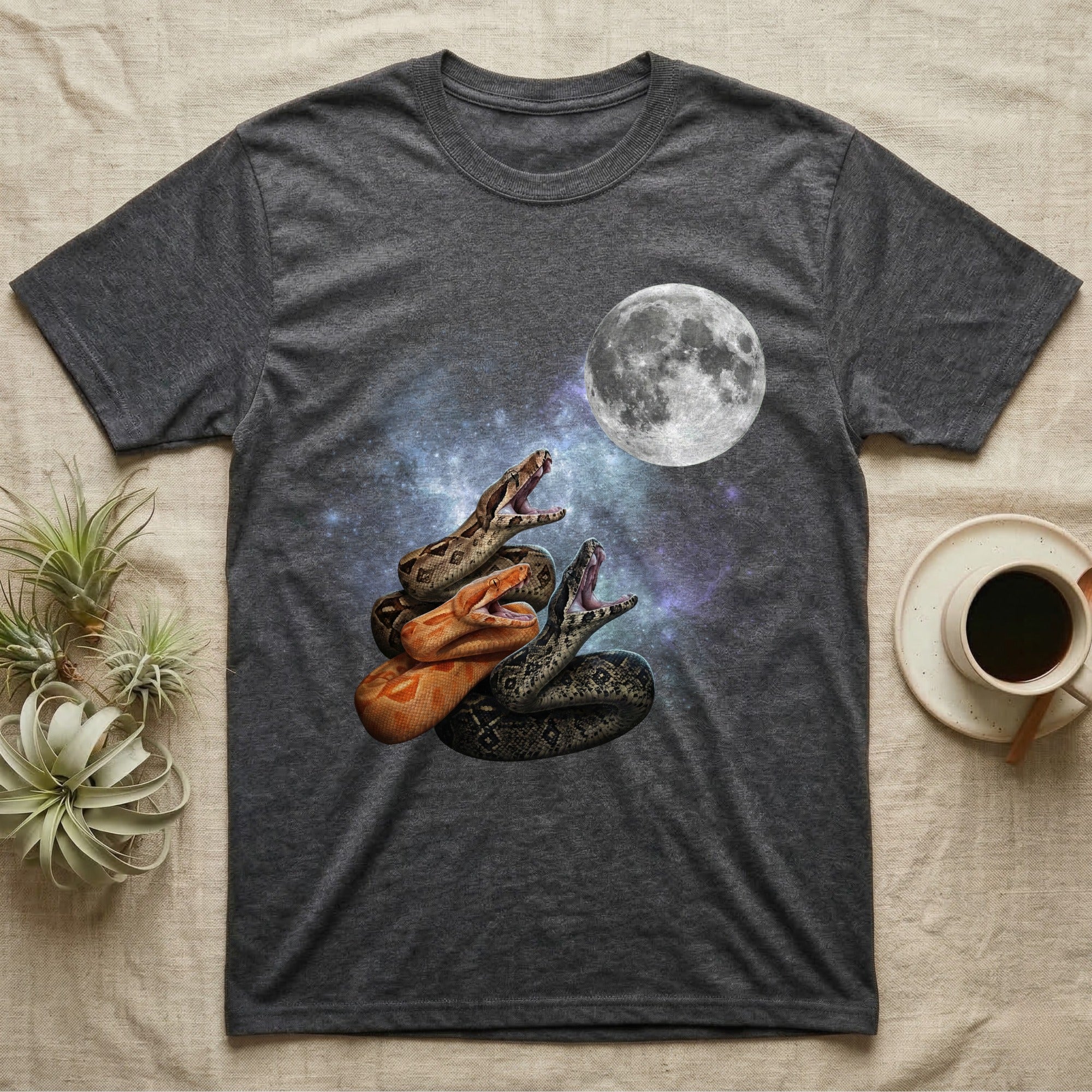 Boa Constrictor Moon Howl T-Shirt in Dark Heather — Three Boa Constrictor colour morphs howling at a full moon over a nebula on a dark grey t-shirt.