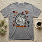 Grey t-shirt with a black and white hedgehog and autumn leaves design.