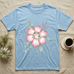 Light blue t-shirt with watercolor leopard gecko on a pink flower.