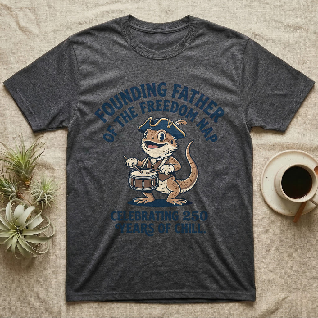 Bearded Dragon Freedom Nap T-Shirt in Dark Heather — Cartoon bearded dragon as a drummer boy under arched text Founding Father of the Freedom Nap, 250 Years of Chill.