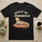Queen Bearded Dragon T-Shirt in Black — Bold-vector illustration of a bearded dragon on a throne-cushion with a crown under varsity Queen of the Household lettering.