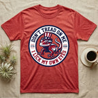 Crested Gecko 1776 T-Shirt in Heather Red — Distressed crest of a crested gecko in a top hat with text Don't Tread On Me and I Lick My Own Eyes.