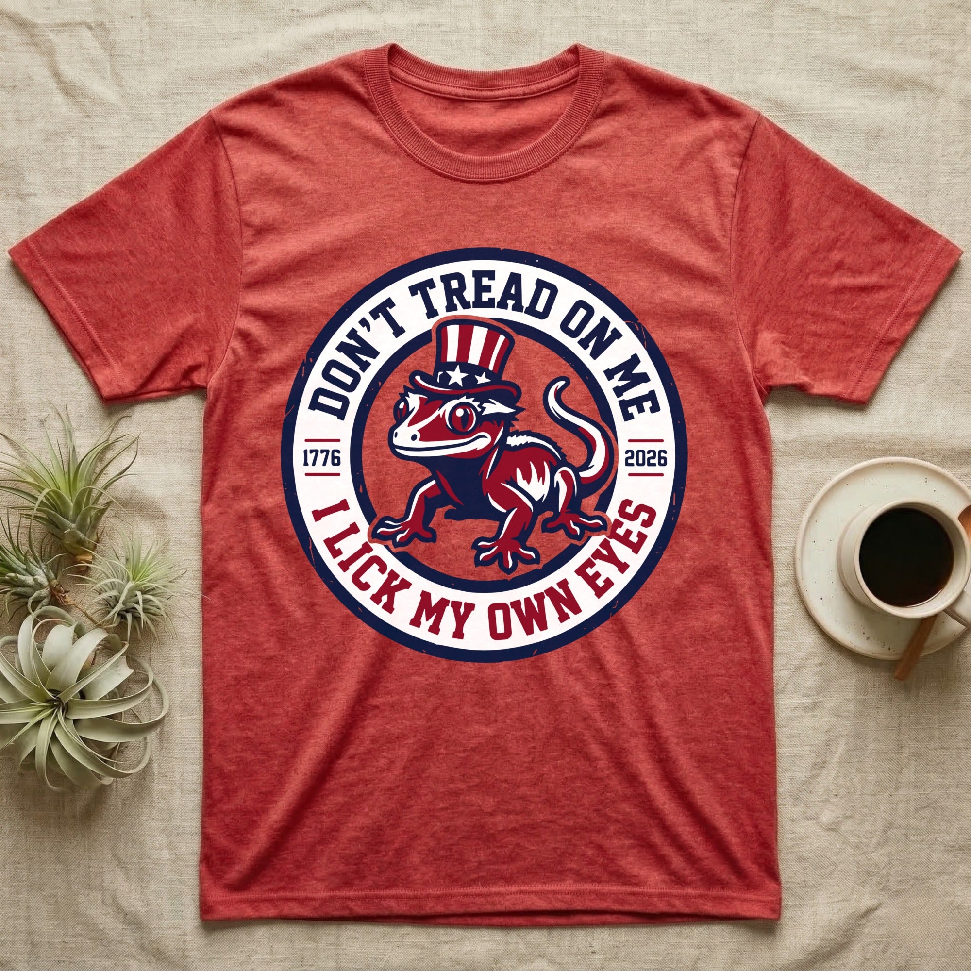 Crested Gecko 1776 T-Shirt in Heather Red — Distressed crest of a crested gecko in a top hat with text Don't Tread On Me and I Lick My Own Eyes.