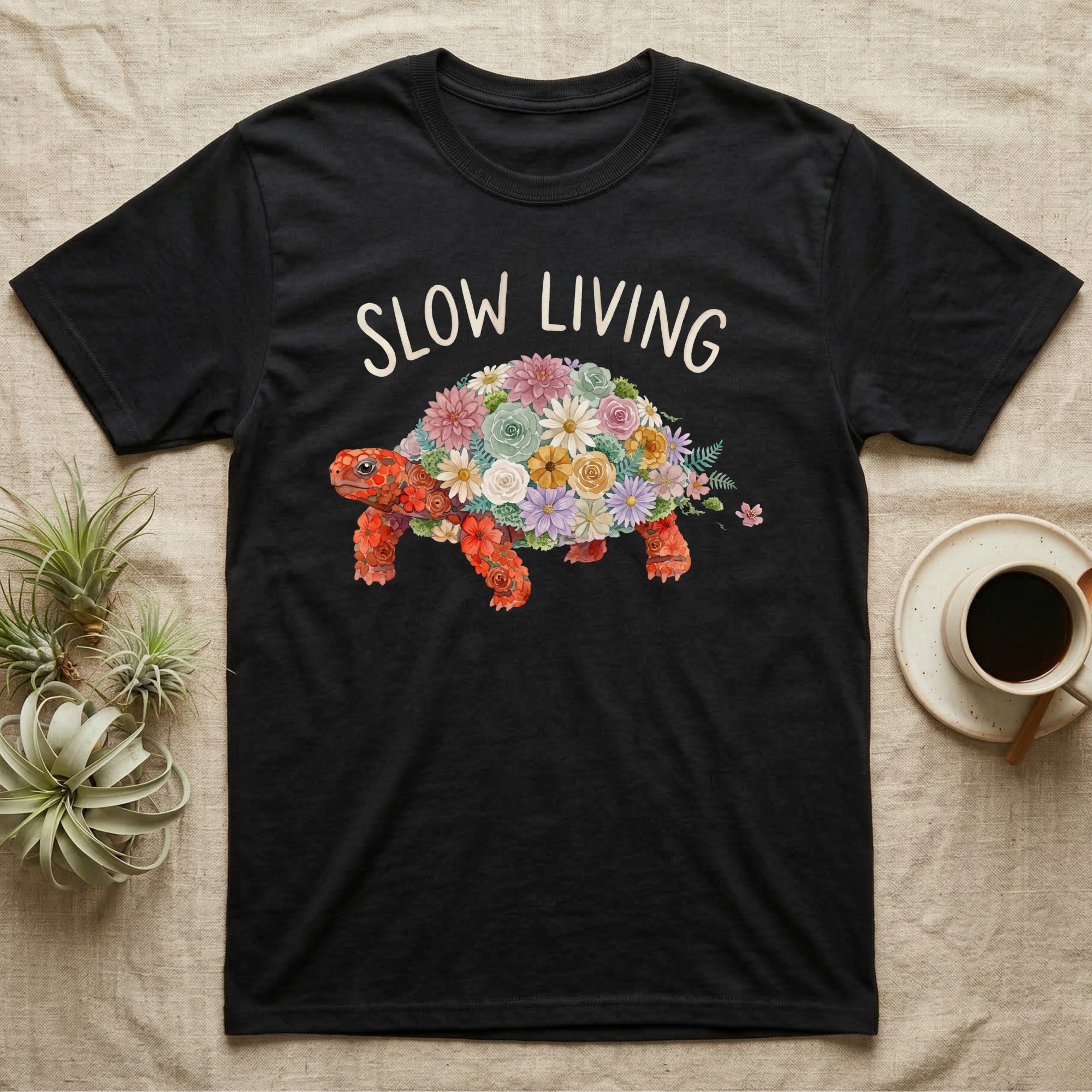 Red-Foot Tortoise Slow Living T-Shirt in Black — Flat watercolour mosaic of a red-foot tortoise built entirely from terrarium flowers and ferns.