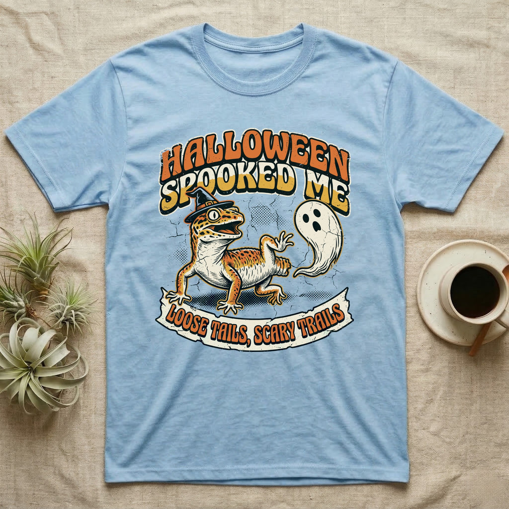 Leopard Gecko Spooked Me T-Shirt in Light Blue — Distressed graphic of a shocked leopard gecko in a witch hat beside its ghost-costumed dropped tail, "Halloween Spooked Me."
