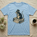 T-shirt with a cartoon rat wearing a hat, sitting on stacked papers.
