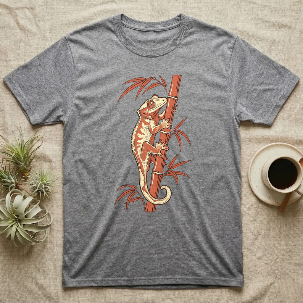 Grey t-shirt featuring an orange crested gecko climbing a bamboo stalk.