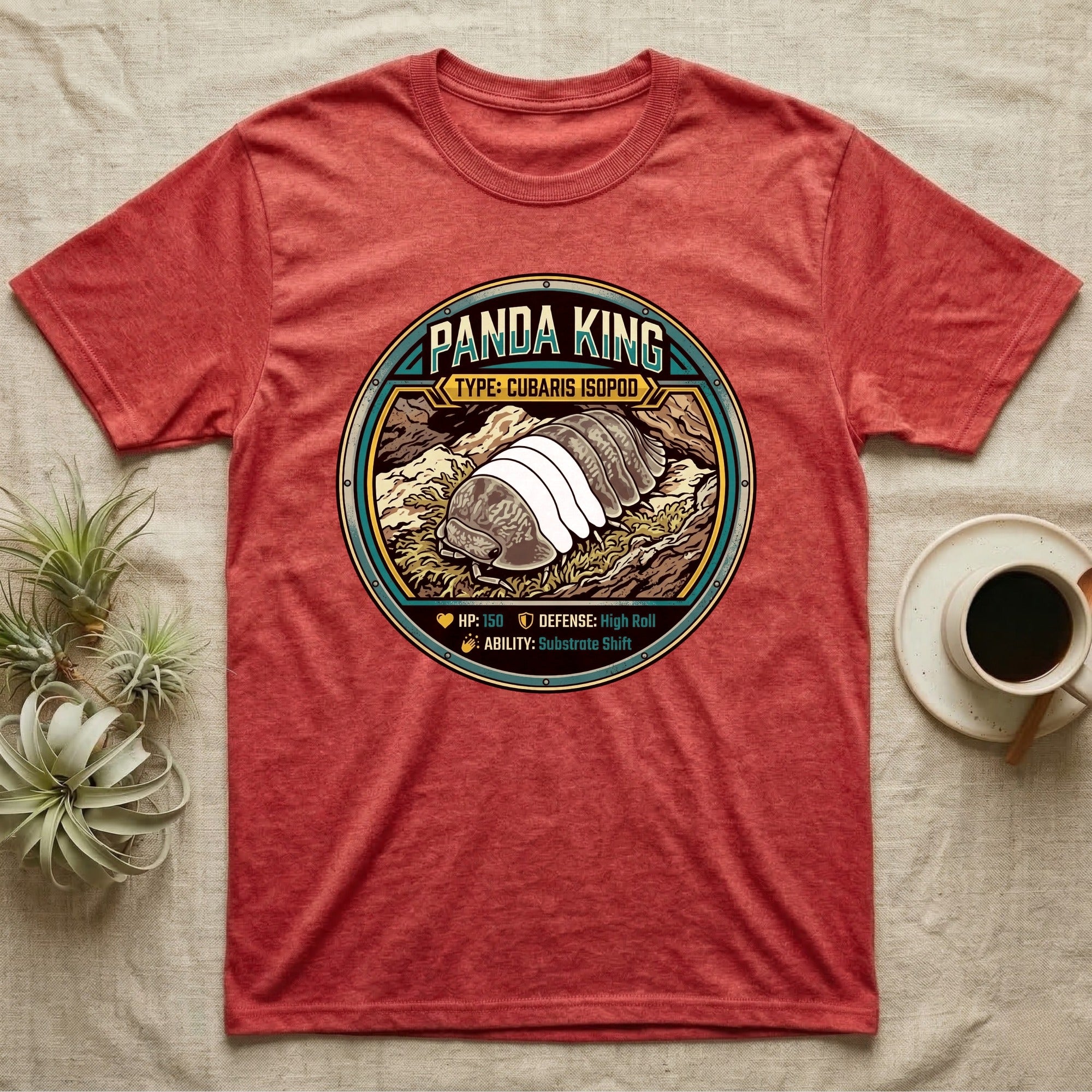 Panda King Isopod Trading Card T-Shirt in Heather Red — Metal stat-card badge showing a Panda King Cubaris isopod on limestone with HP and ability lines.