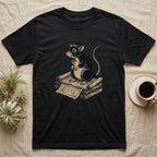 Black t-shirt with illustration of a rat wearing a hat and bow tie, sitting on scrolls.