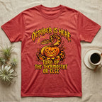 Ball Python October Thermostat T-Shirt in Heather Red — Metal-band style ball python coiled over a glowing jack-o'-lantern, "October Is Here, Turn Up the Thermostat Or Else."