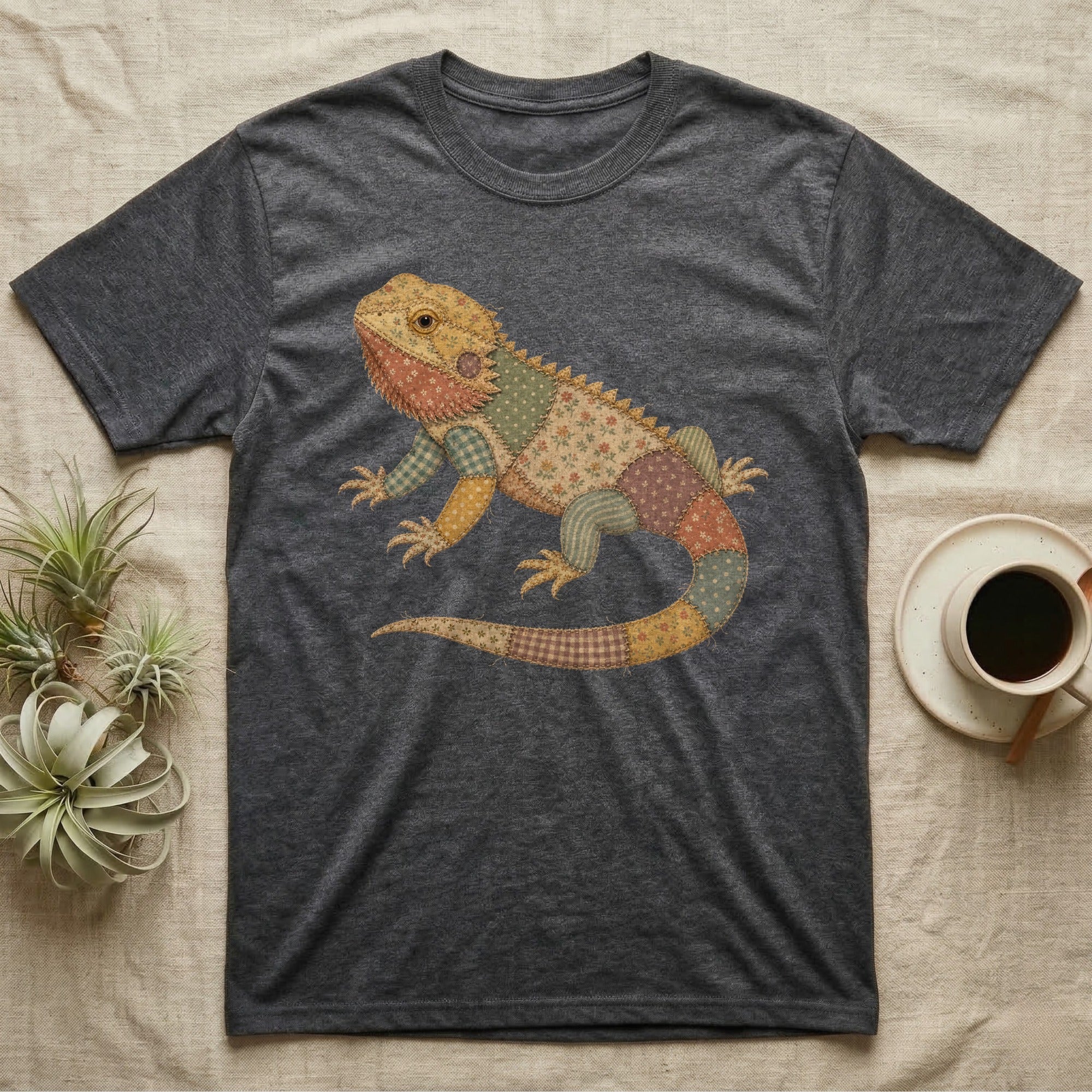 Dark gray t-shirt with a colorful patchwork bearded dragon graphic.