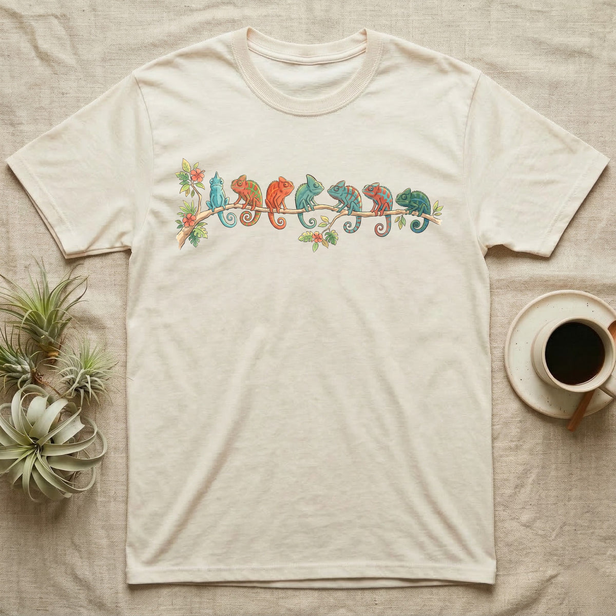 Panther Chameleon Canopy Crew T-Shirt in Natural — Watercolor illustration of seven panther chameleons in Madagascar locale colours on a branch, dark grey T-shirt design.