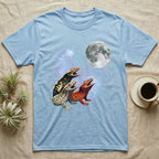 Crested Gecko Moon Howl T-Shirt in Light Blue — Three Crested Gecko colour morphs howling at a full moon over a nebula on a dark grey t-shirt.