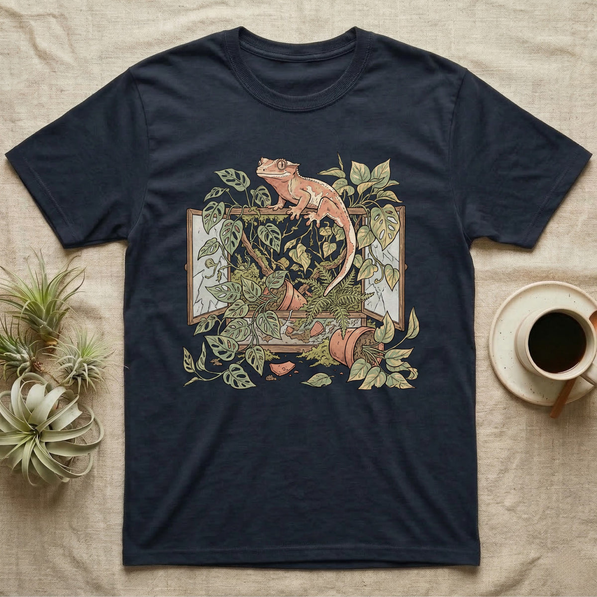 Bioactive Crested Gecko T-Shirt in Navy — Botanical illustration of a smug crested gecko perched atop a lush overgrown planted vivarium spilling vines.