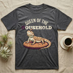 Queen Bearded Dragon T-Shirt in Dark Heather — Bold-vector illustration of a bearded dragon on a throne-cushion with a crown under varsity Queen of the Household lettering.