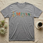 Panther Chameleon Canopy Crew T-Shirt in Sport Grey — Watercolor illustration of seven panther chameleons in Madagascar locale colours on a branch, dark grey T-shirt design.