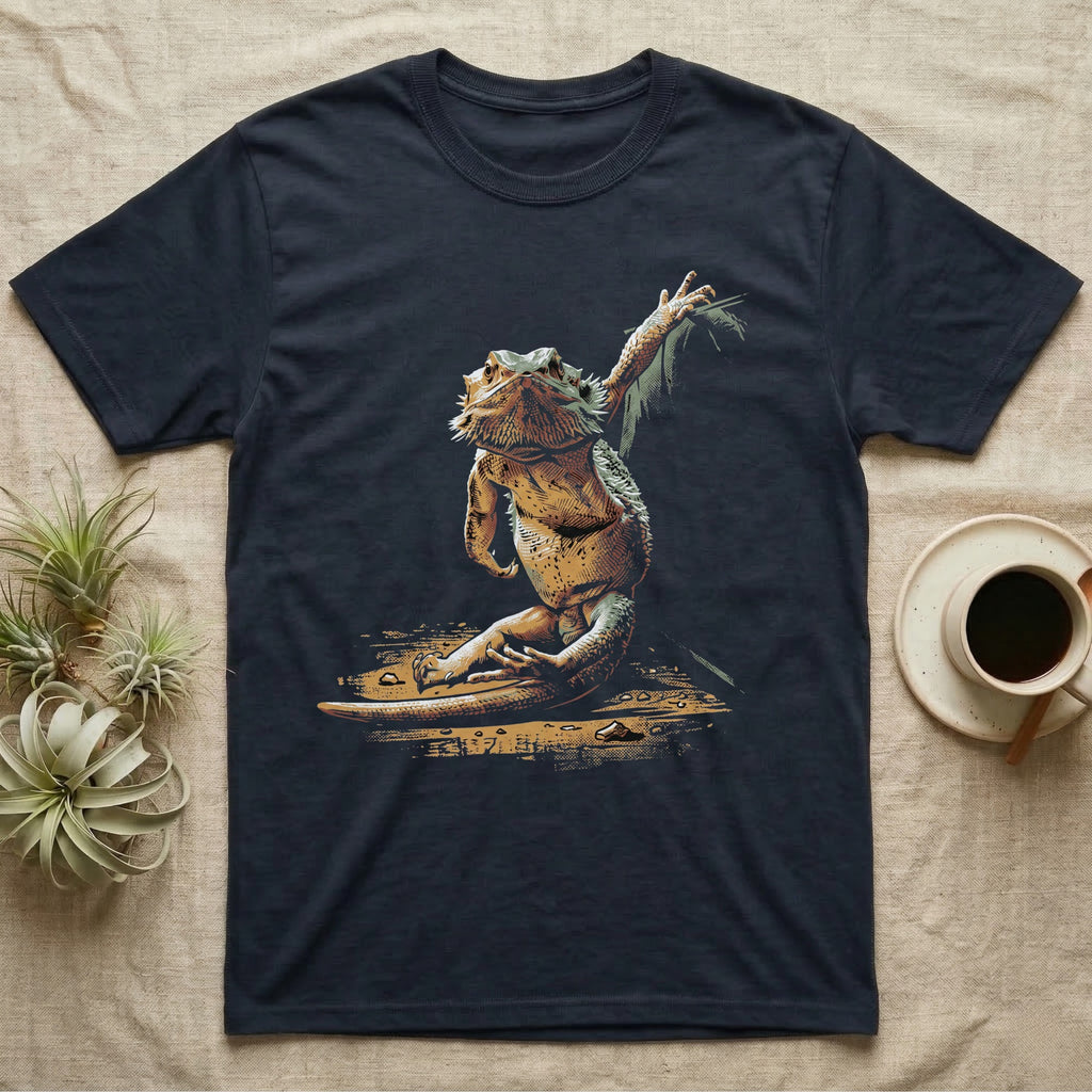 Vintage ink illustration of a bearded dragon seated with legs folded, one arm raised overhead toward a leafy frond, chin lifted, no on-shirt text. — shown on a Navy tee.